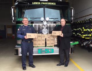 Fire Chief James Alexander and Fire Marshal Charles DeFrangesco with the allotment of smoke detectors.